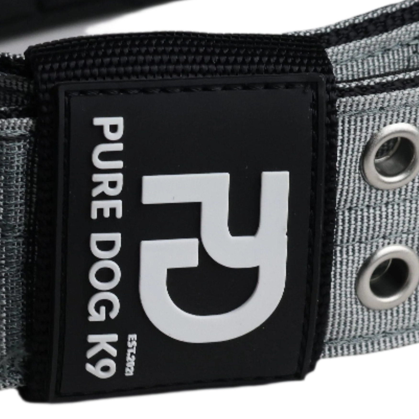 Pure Dog K9 logo patch on grey sport dog collar with metal grommets