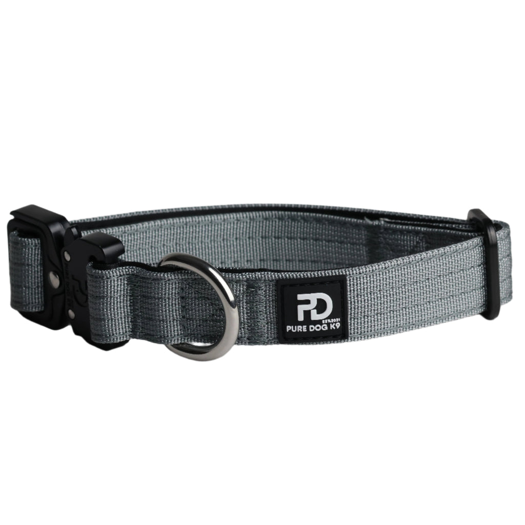 Grey tactical dog collar with black clasp, metal ring, and brand logo patch