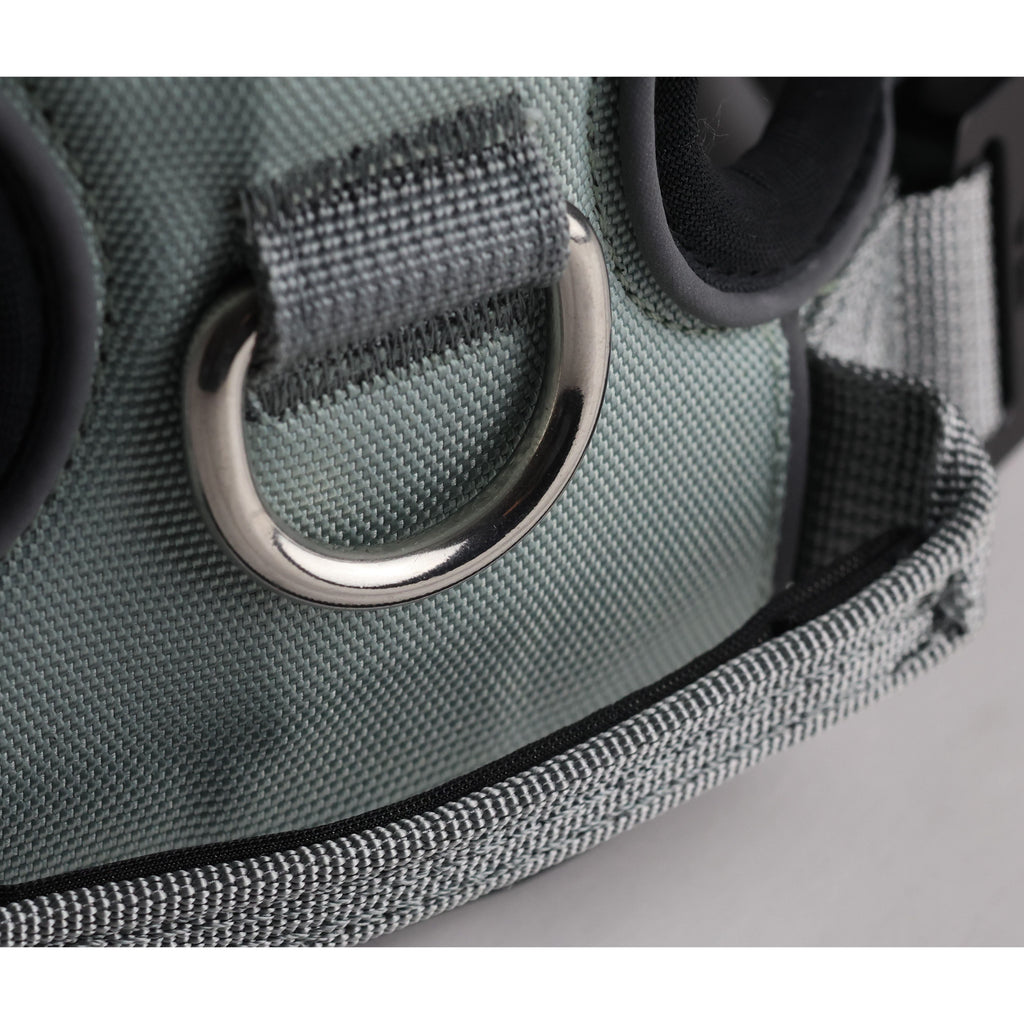 Grey padded dog harness close-up of front metal D-ring on fabric panel