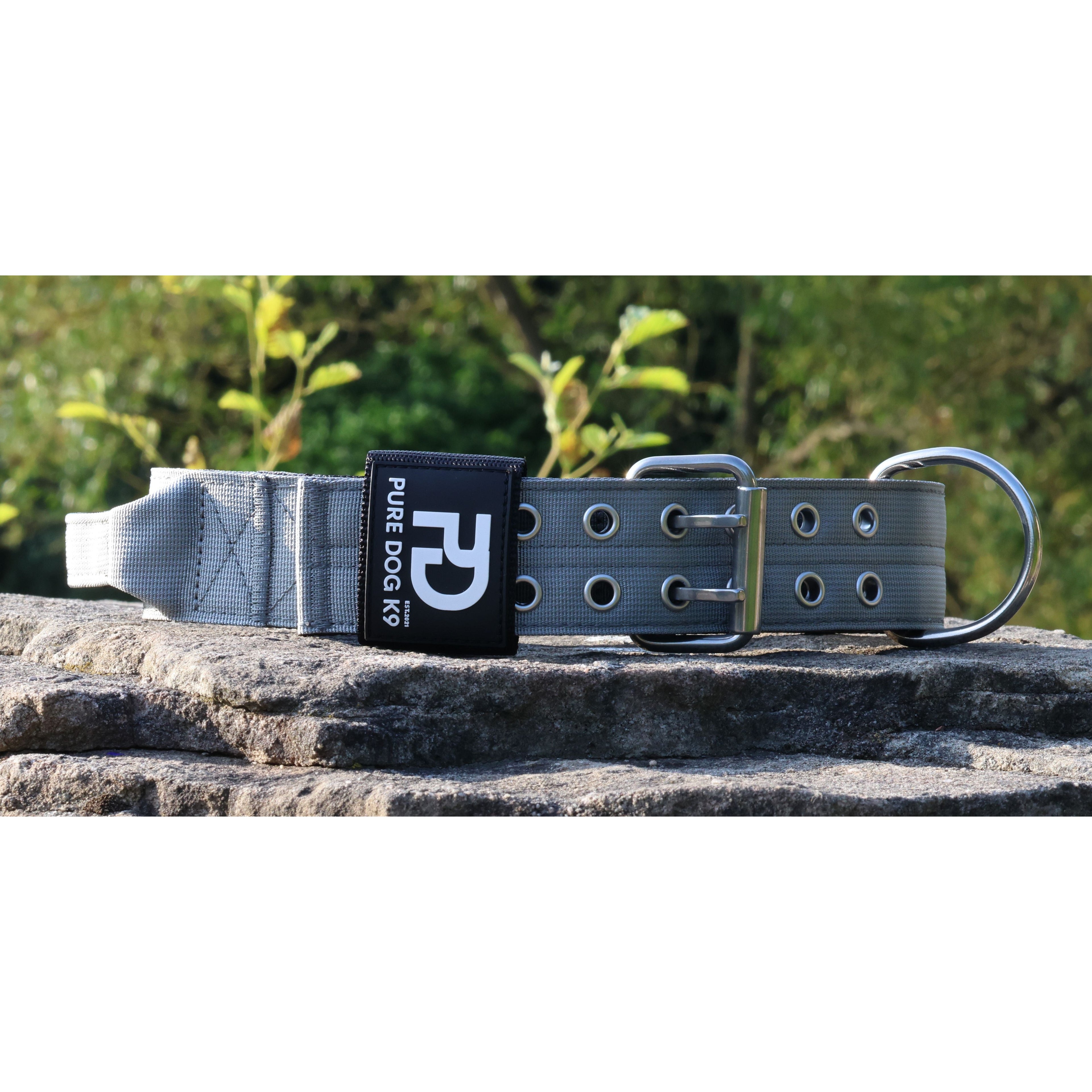 Grey sport dog collar with metal D-ring, buckle, and logo patch
