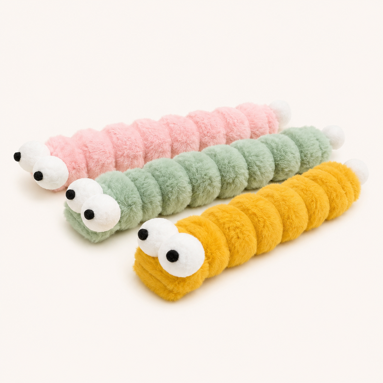 Large plush caterpillar catnip kicker toy set, pink, green, and yellow segmented tubes