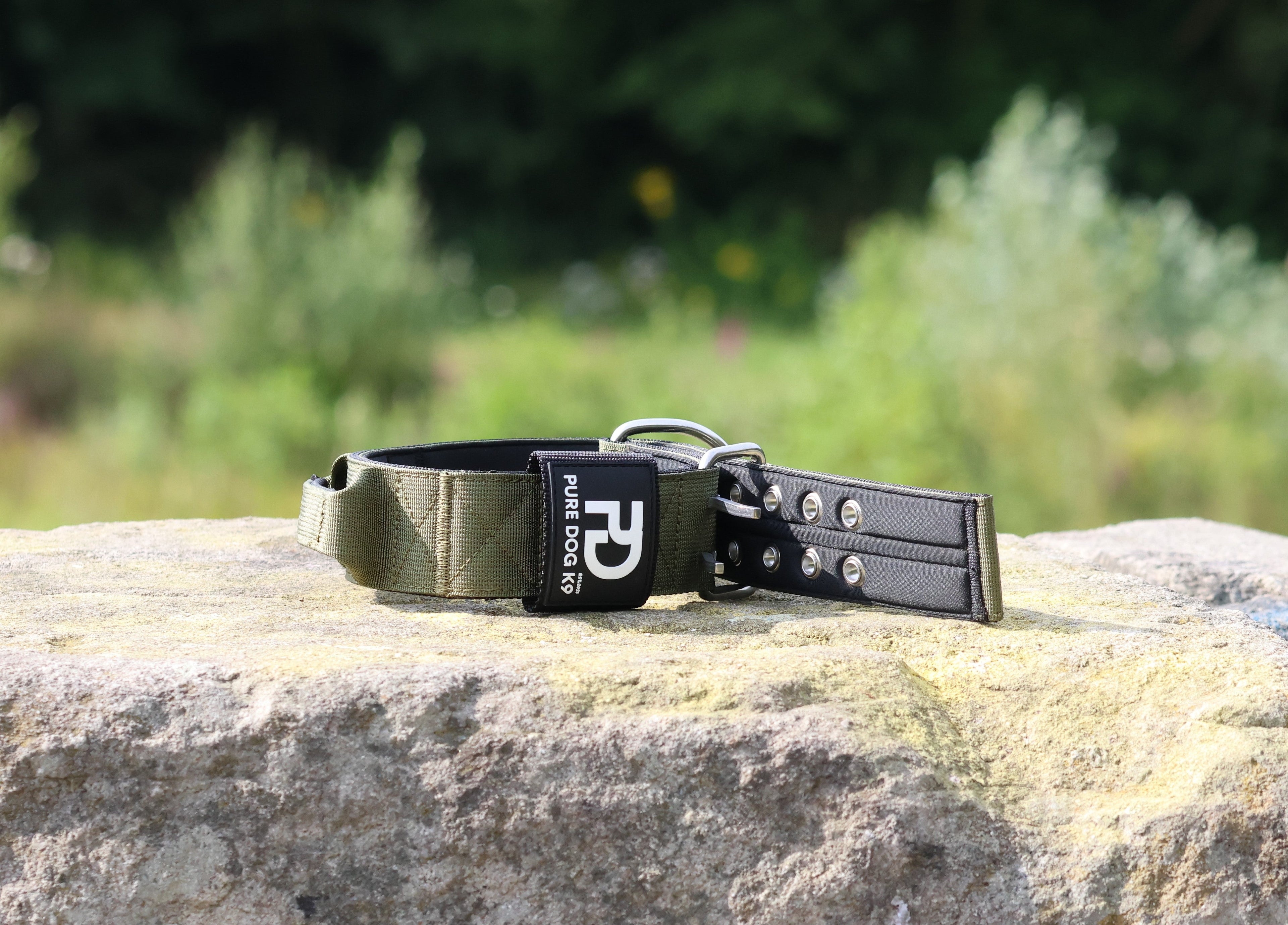 Khaki and black sport dog collar with metal D-ring and perforated adjustment holes
