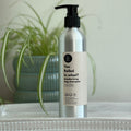 250ml deodorising dog shampoo bottle with black pump and silver bottle body