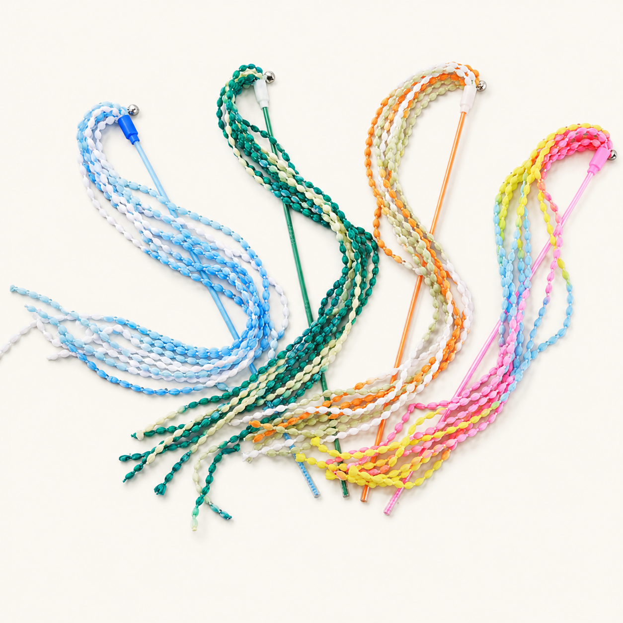 Cat stick toy with braided rainbow ribbon strands and dangling tassels
