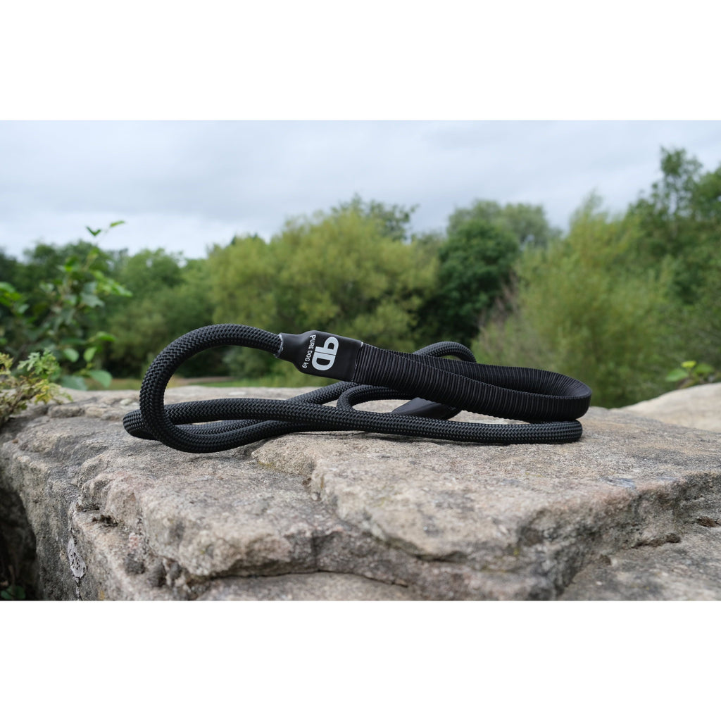 Nylon slip lead with rubber stopper, dark color, coiled
