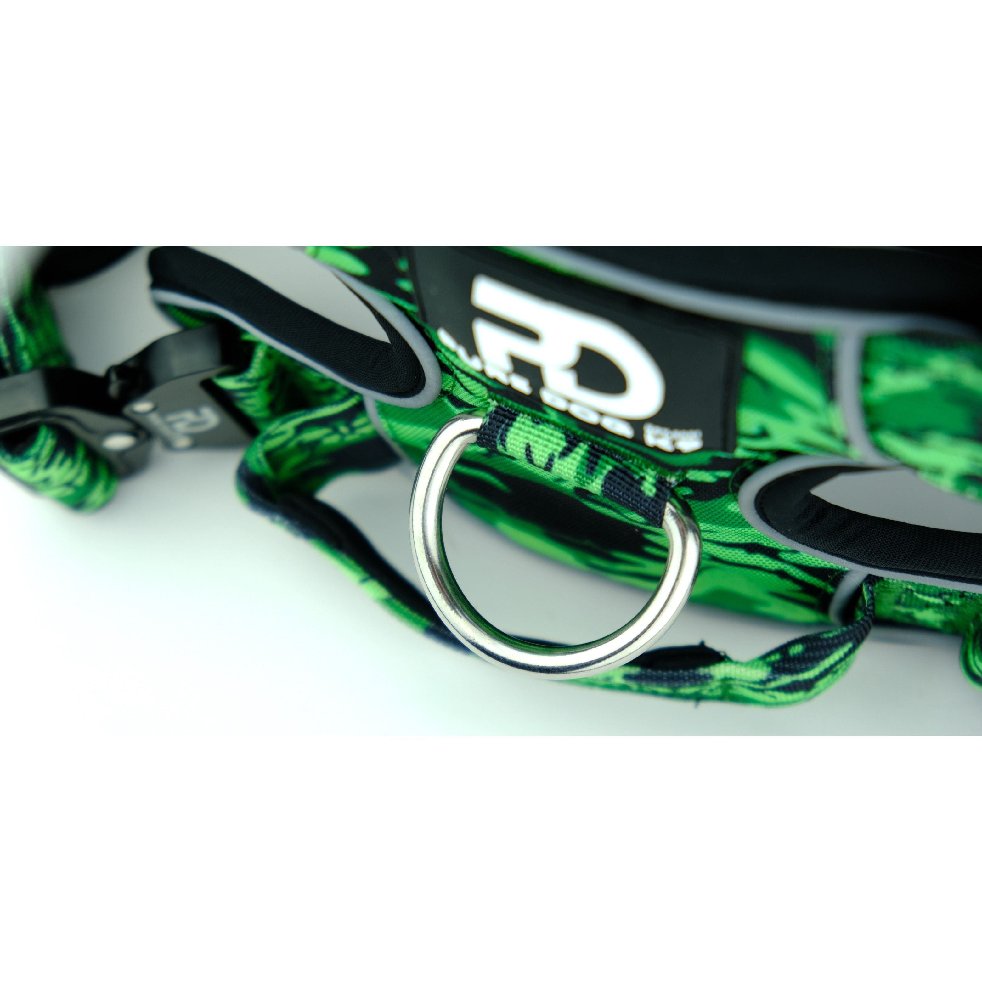 Green camo harness chest panel with metal D-ring and black adjustment strap