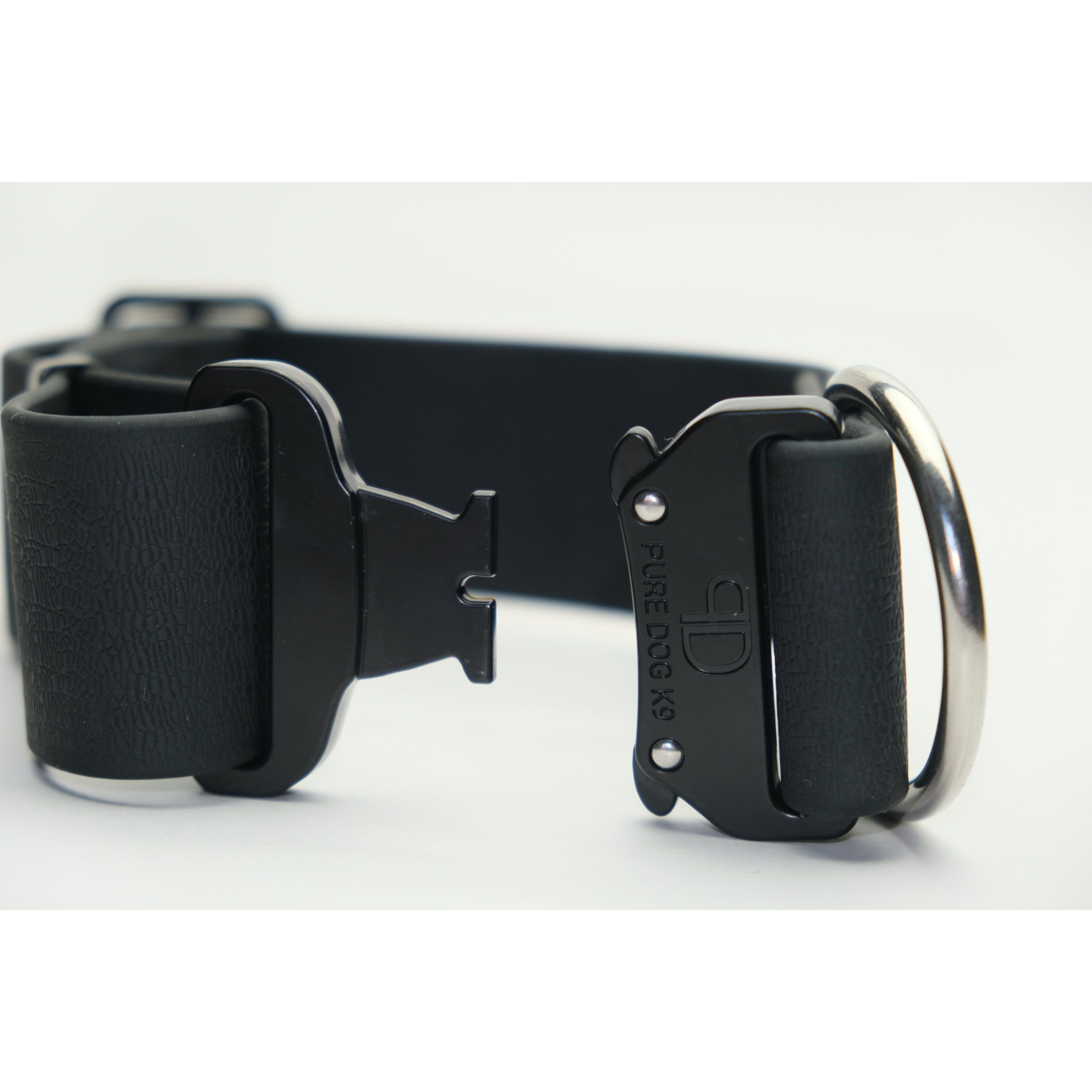 Black dog collar with wide strap, quick-release side buckle, and metal D-ring