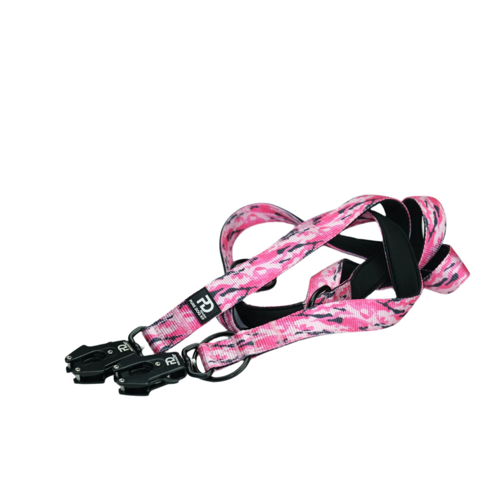 Multifunctional dog leash in pink camo with black metal clips and adjustable strap