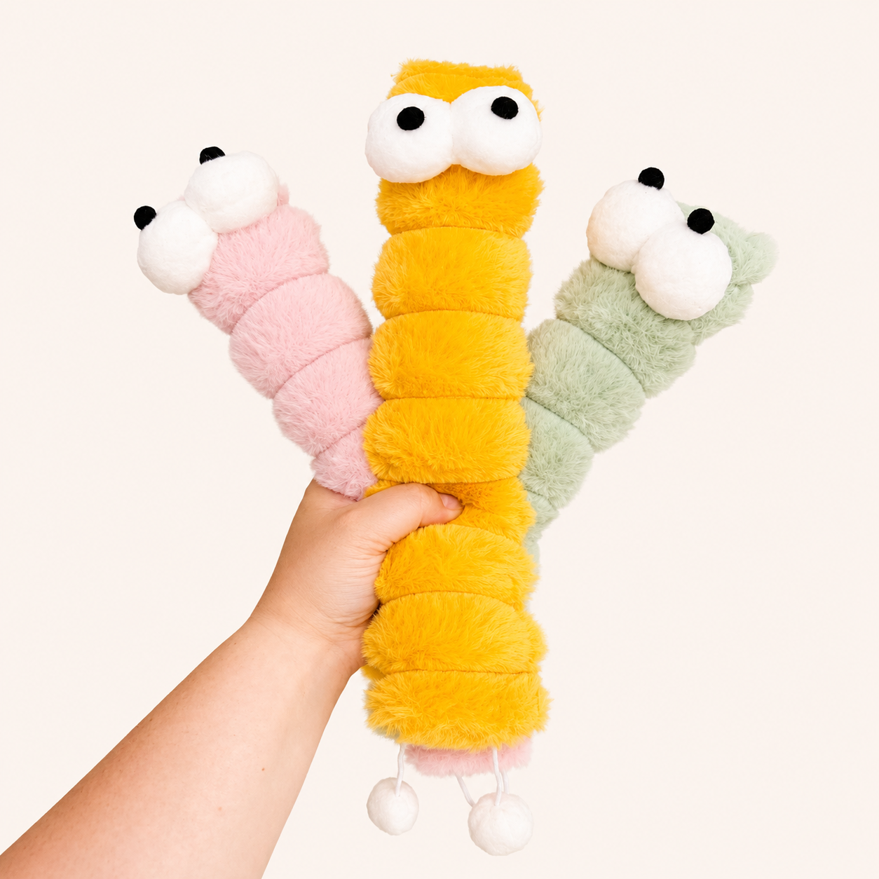 Large plush caterpillar catnip kicker toy, yellow segmented body with white face and paws