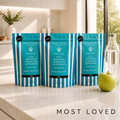 Dog hydration supplement pouches, teal blue, arranged in a row on a kitchen counter