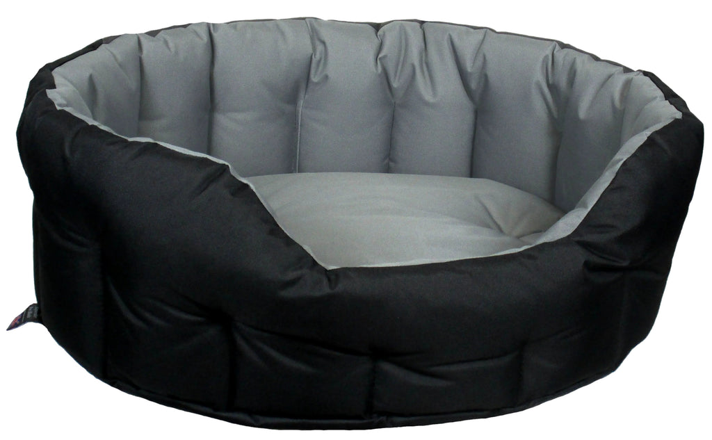 Oval high-sided waterproof dog bed with black outer sides and light gray interior liner.