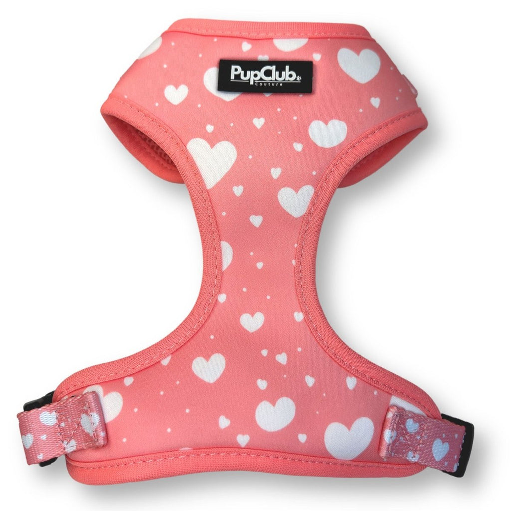 Pink dog harness with white hearts and adjustable straps