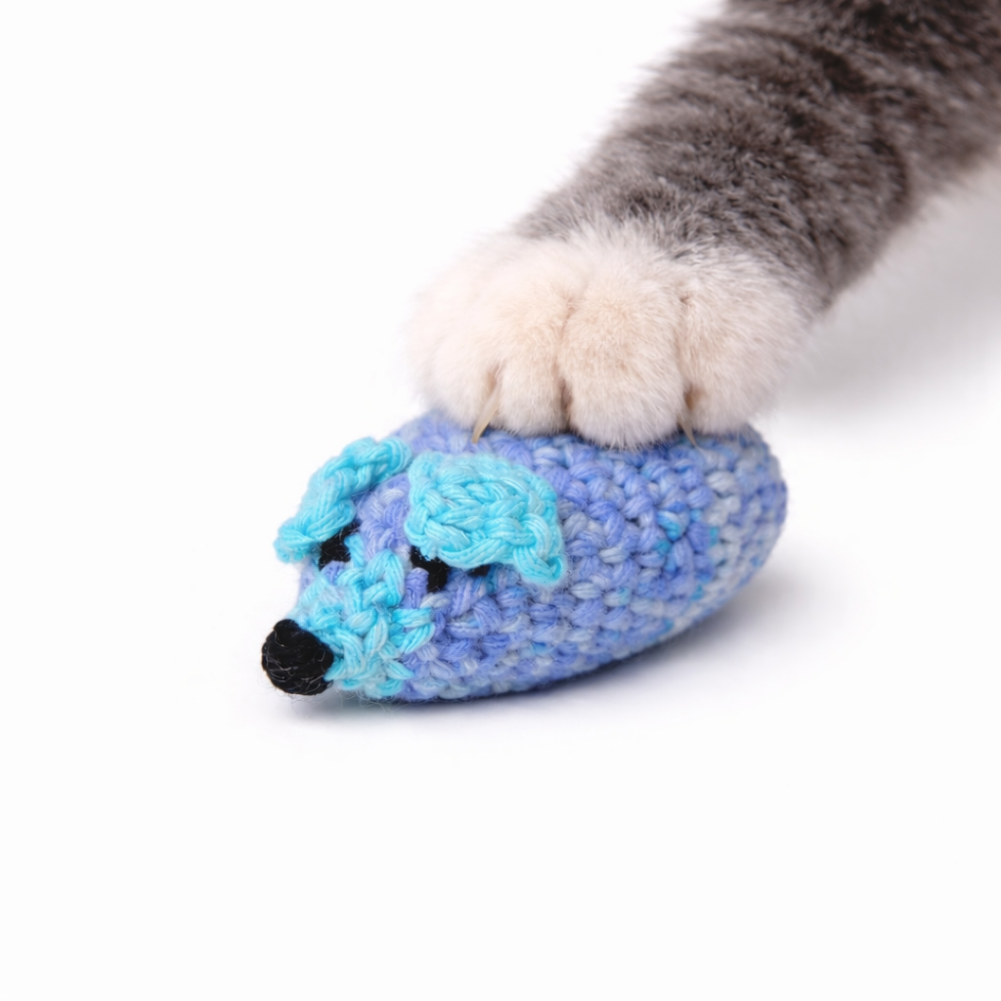 Blue crochet catnip mouse toy with yarn tail and small bead details