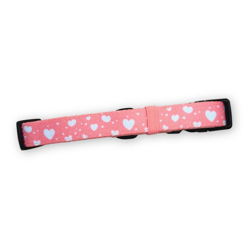 Peachy pink dog collar with white hearts, black buckle, PupClub label strip