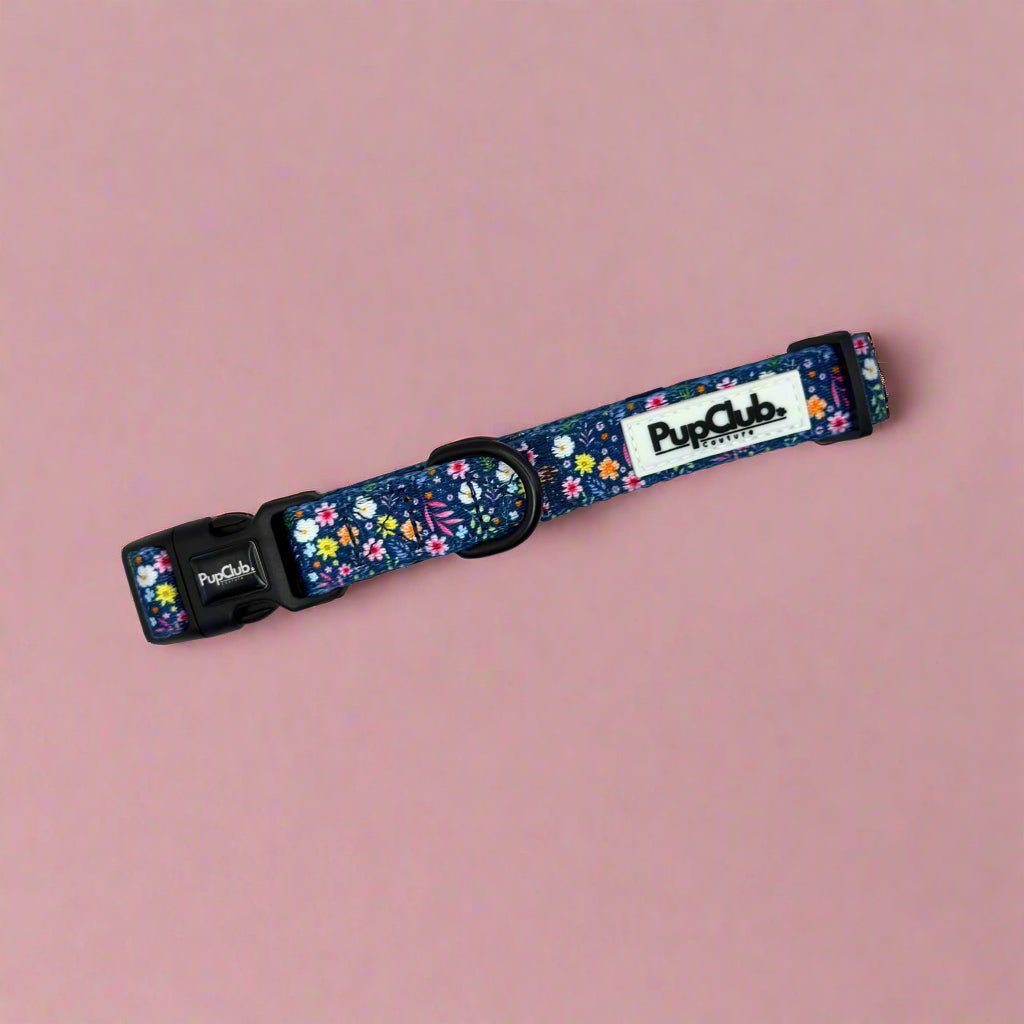 Dog collar, dark blue floral fabric with adjustable black buckle and D-ring.