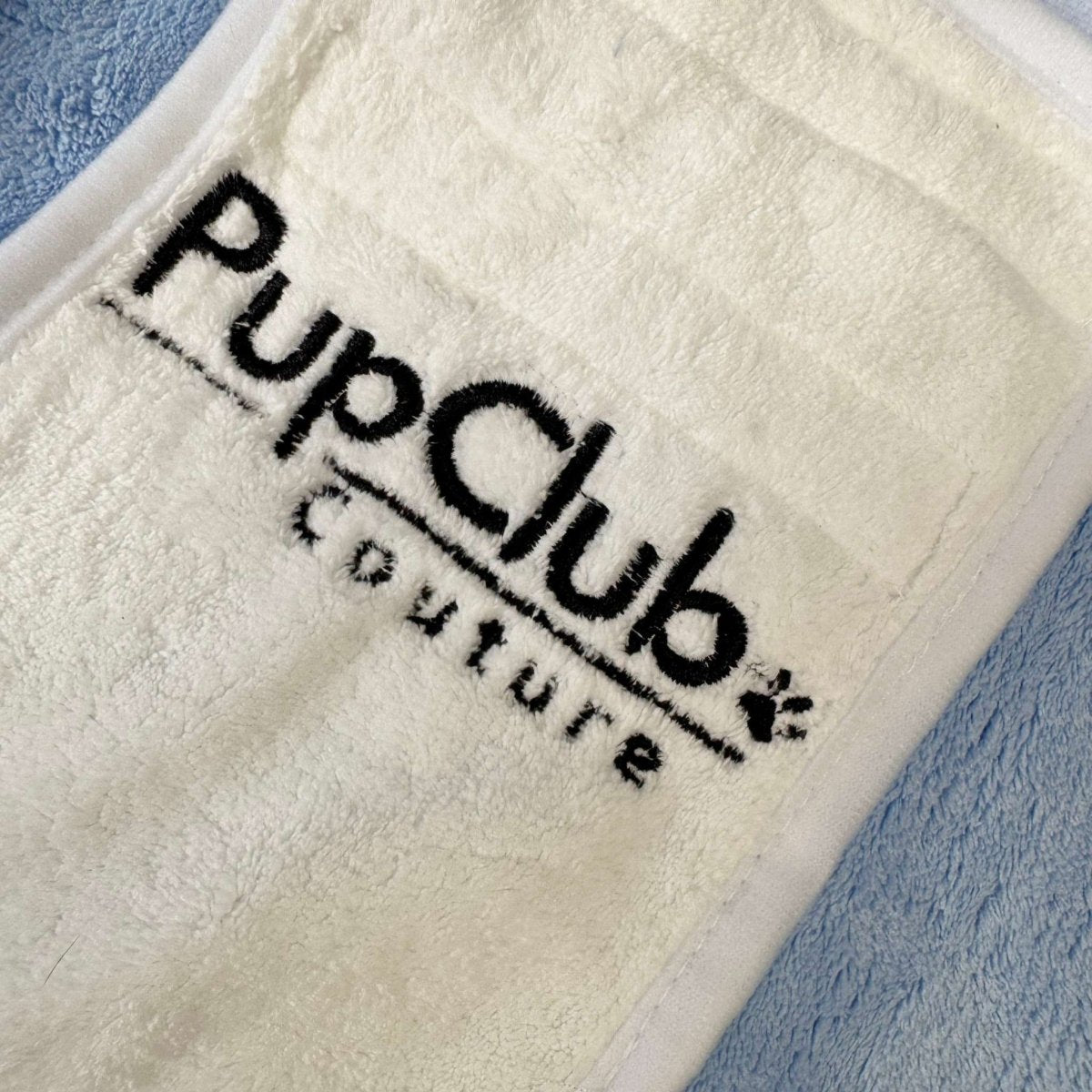 Blue drying robe label patch reading "PupClub" and "Nature"