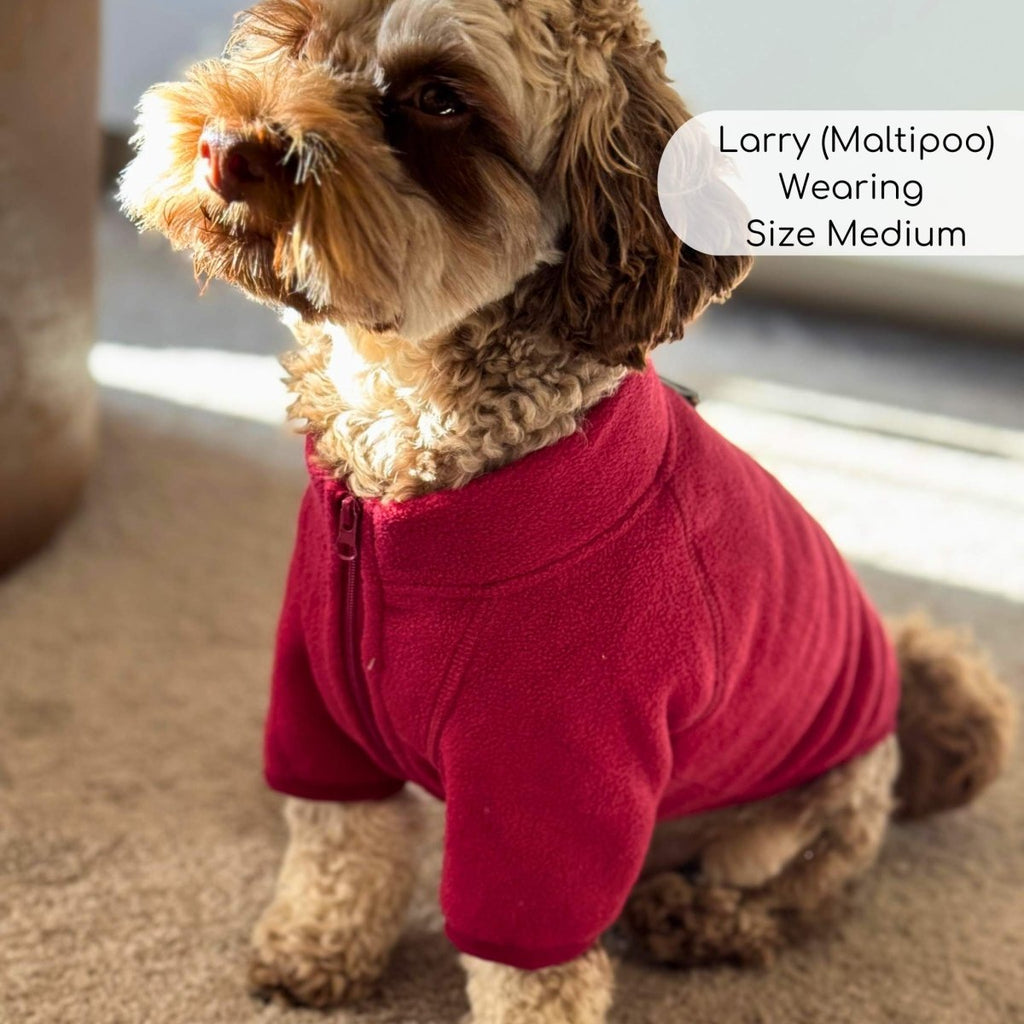 Berry red fleece dog coat with front zipper, worn by small dog