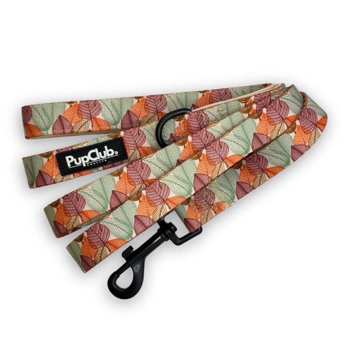 Patterned dog leash with autumn leaf design, black clip, and PupClub label