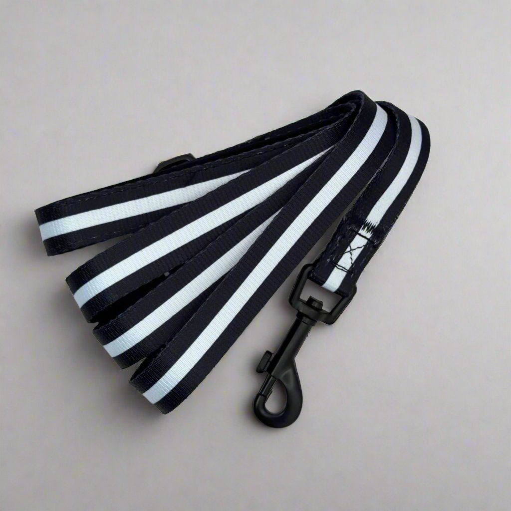 Black and white striped dog leash lead with metal clasp