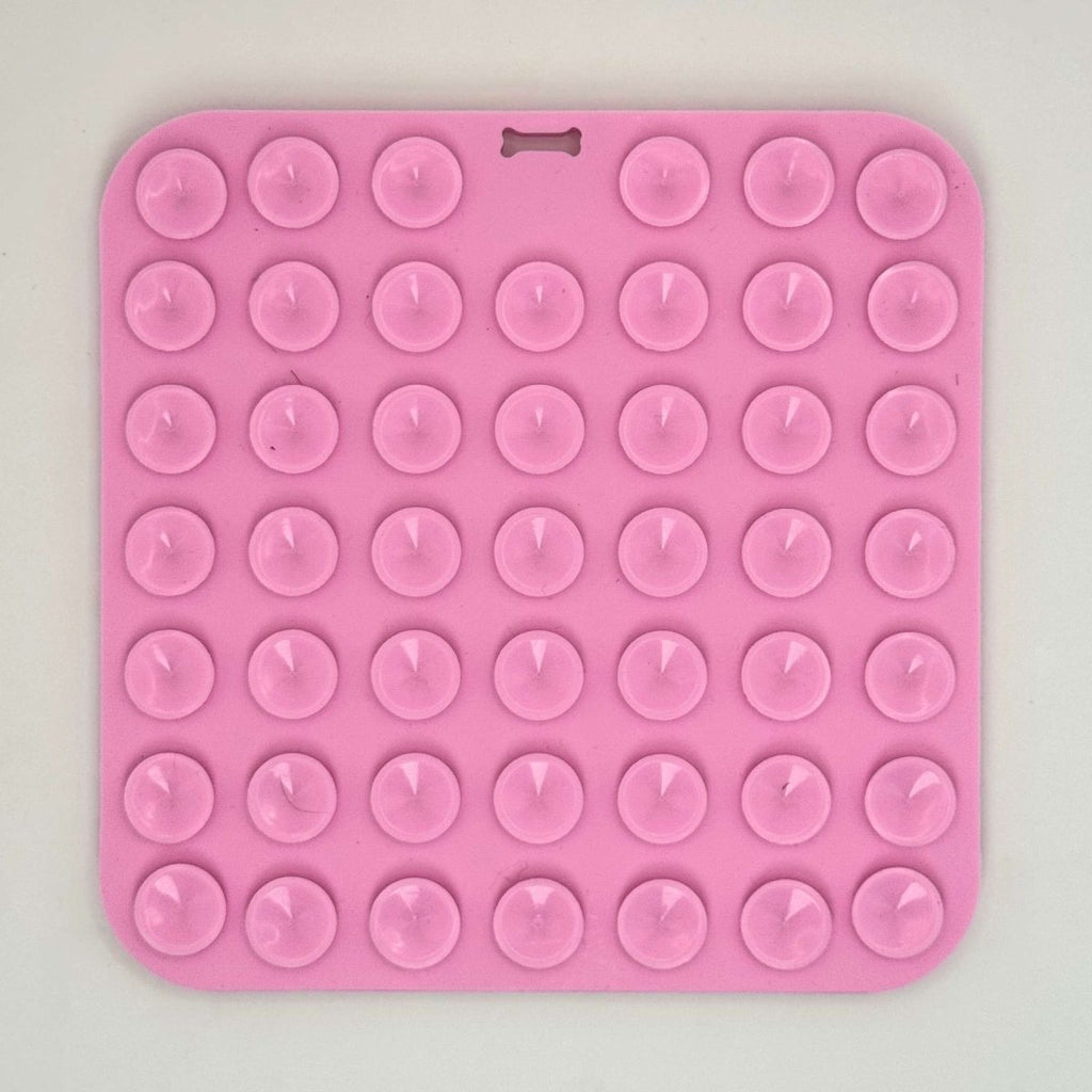 PupClub Couture pink silicone dog lick mat with raised round nibs across surface