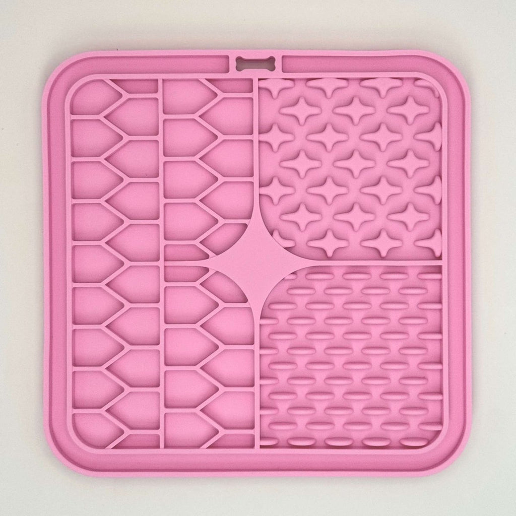 PupClub Couture pink silicone dog lick mat with star, grid, and bubble textures