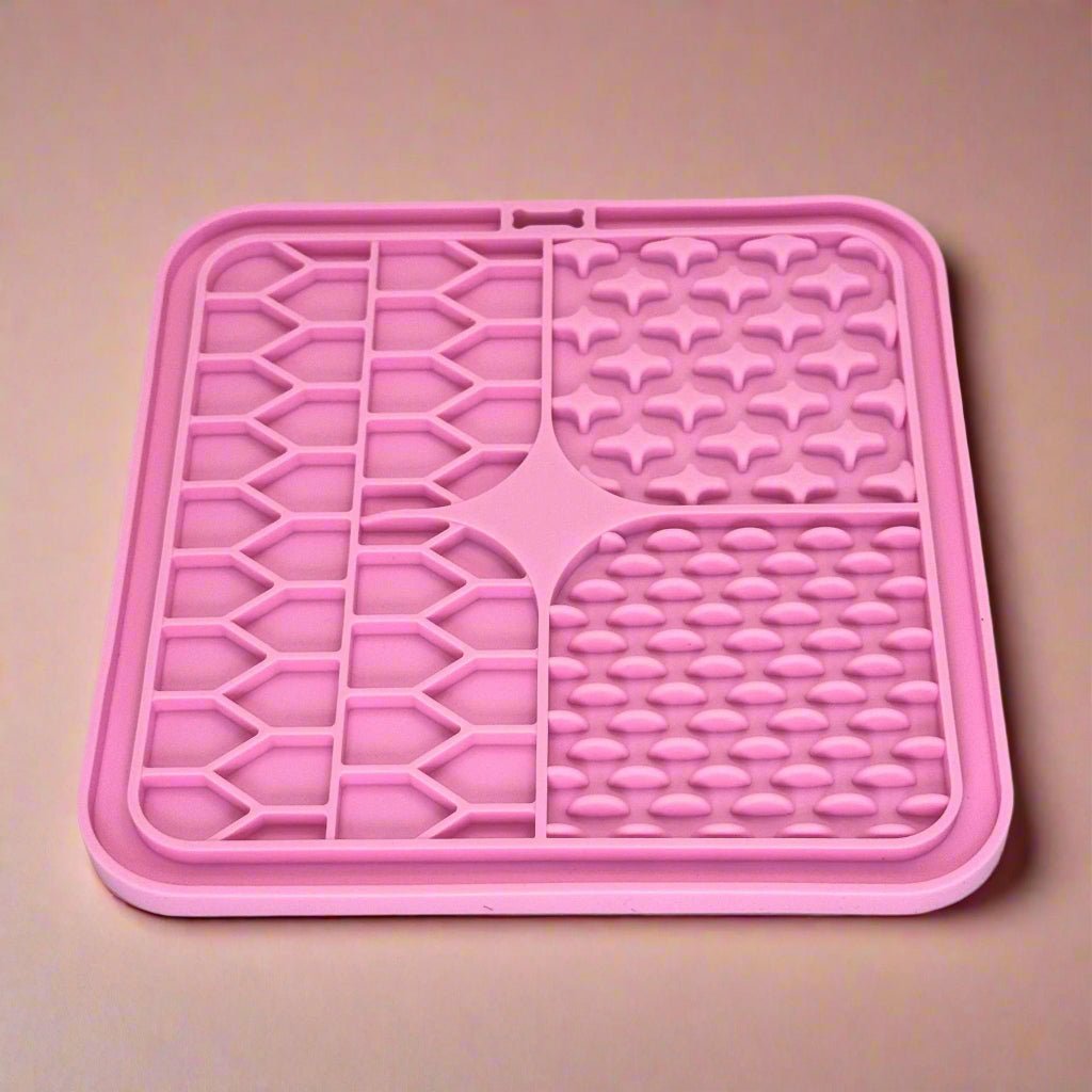 PupClub Couture pink silicone dog lick mat with geometric maze and heart shapes