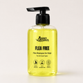 Dog flea shampoo bottle with pump; clear yellow liquid, labeled "Flea Free"