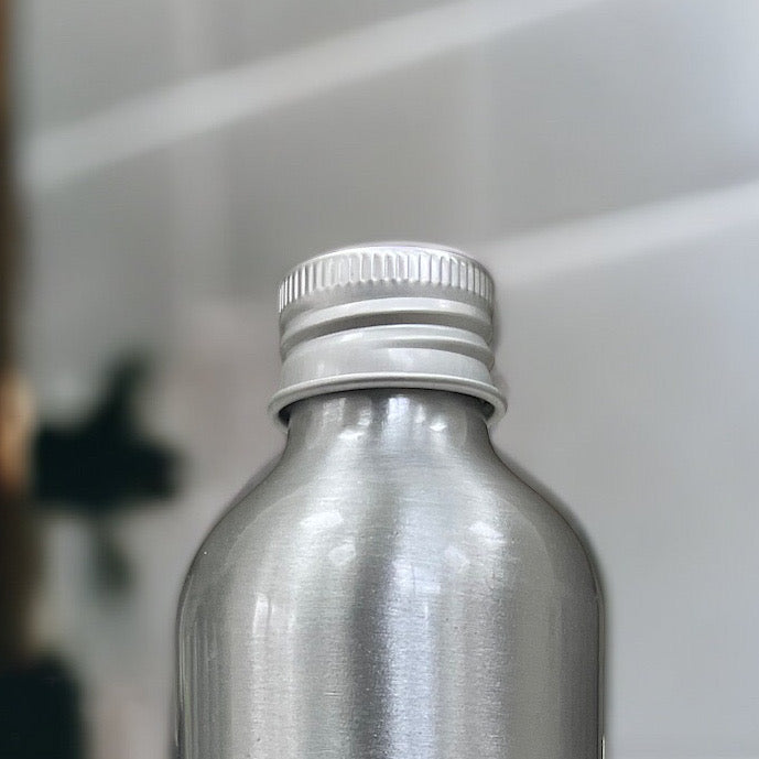 Silver screw-top cap on deodorising dog shampoo bottle
