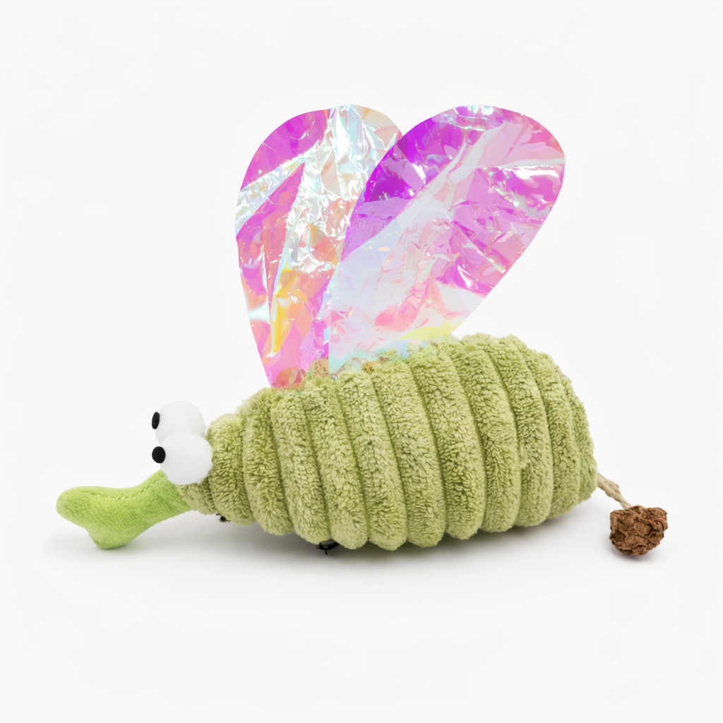 Green plush mosquito toy with white face, holographic wings, and brown dangling charm