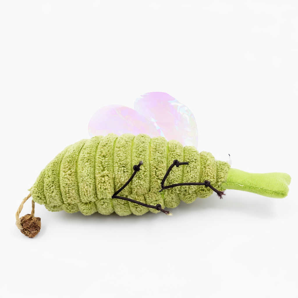 Green plush mosquito toy with white face and holographic wings, side view