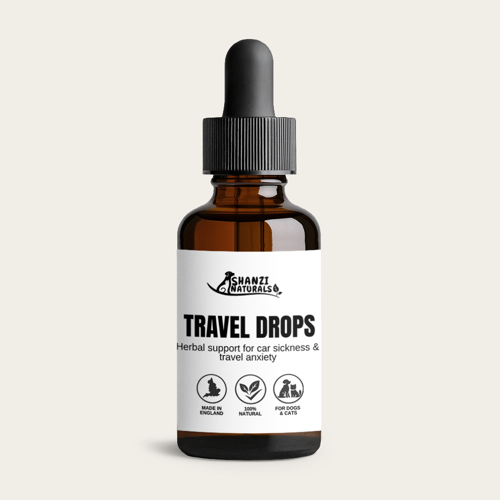 Amber glass dropper bottle with black cap, Travel Drops label visible