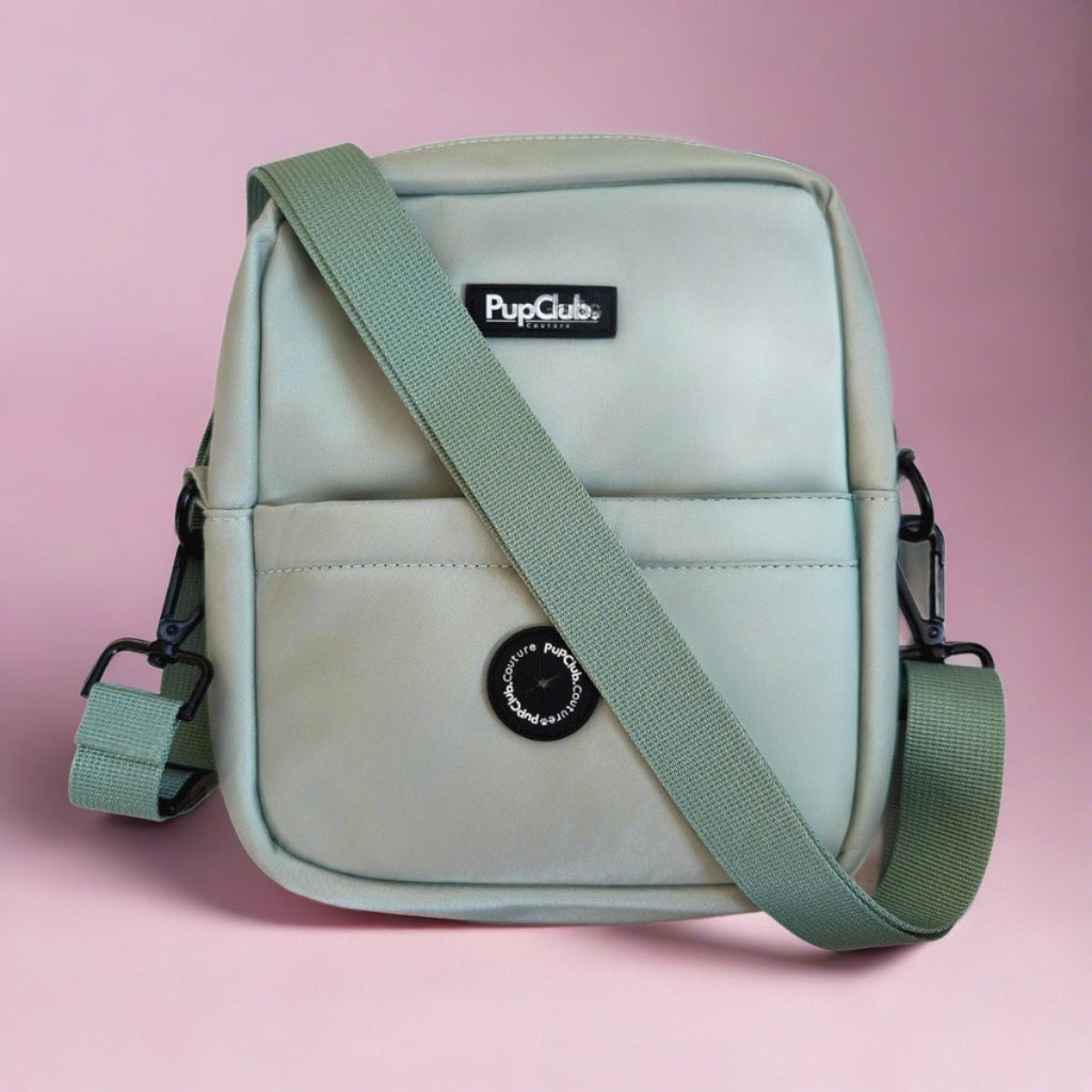 Mini dog walking bag, sage green crossbody with webbed strap and front logo patch