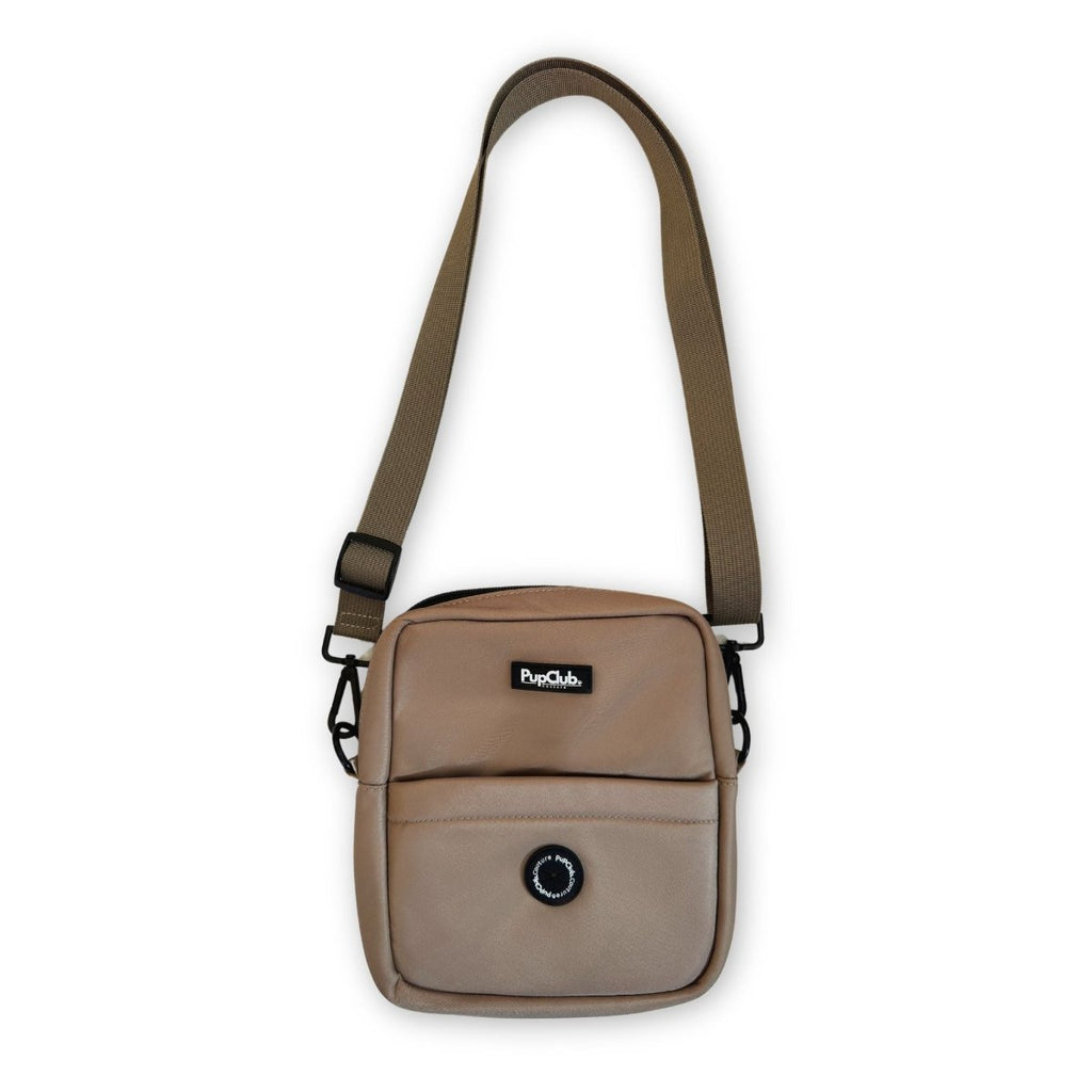 Tan mini crossbody dog bag with PupCub logo, front flap, and adjustable straps