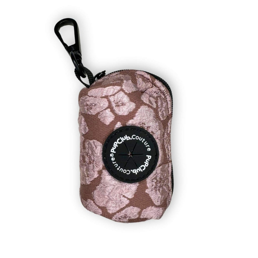 Floral poo bag holder with round logo patch and black carabiner clip, zip pouch
