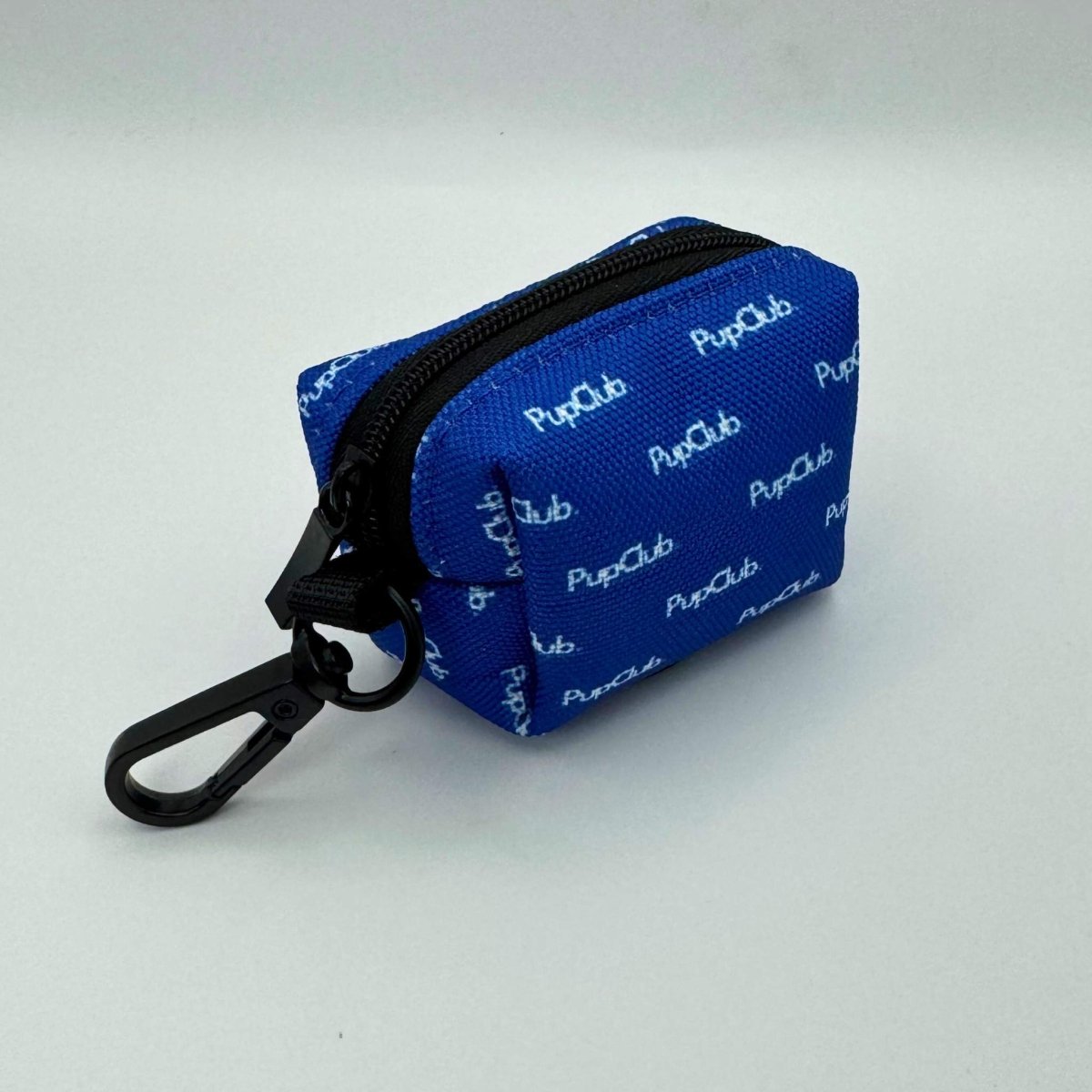 Royal blue dog poop bag holder, side view with zipper and black carabiner clip