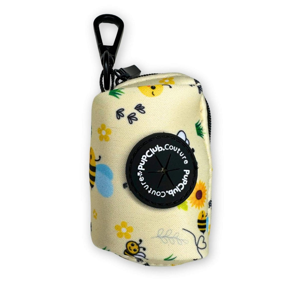 Poo bag holder pouch in cream fabric with bee and flower print, zip top and clip