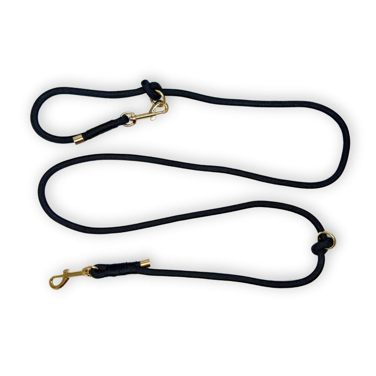 Black rope dog lead set with gold hardware and connected leash segments
