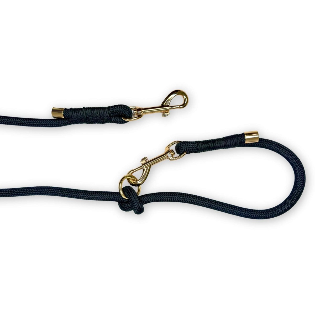 Black rope dog lead with gold trigger clasp and swivel ring on a looped leash