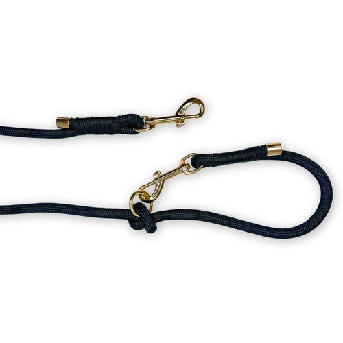 Black rope dog lead with gold trigger clasp and swivel ring on a looped leash