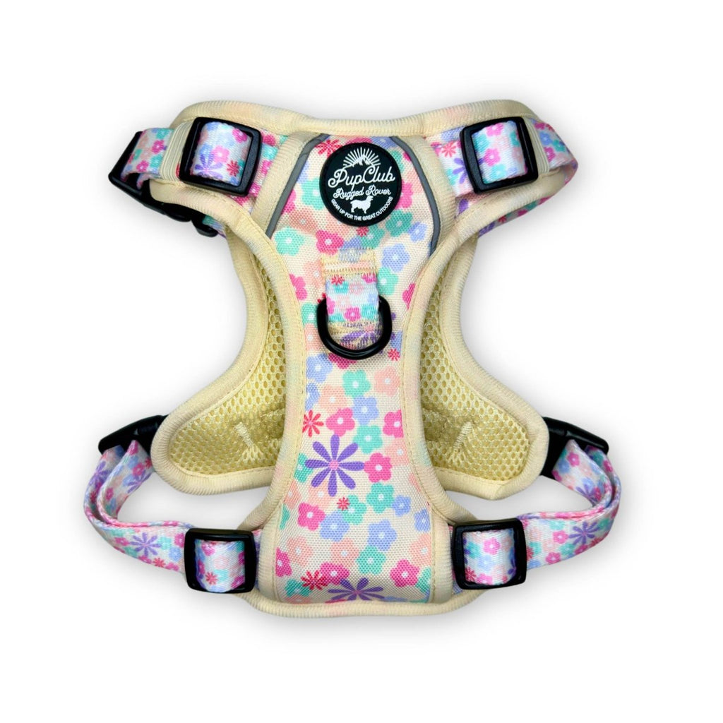 Front view padded dog harness with pastel petal floral print, mesh lining, black straps