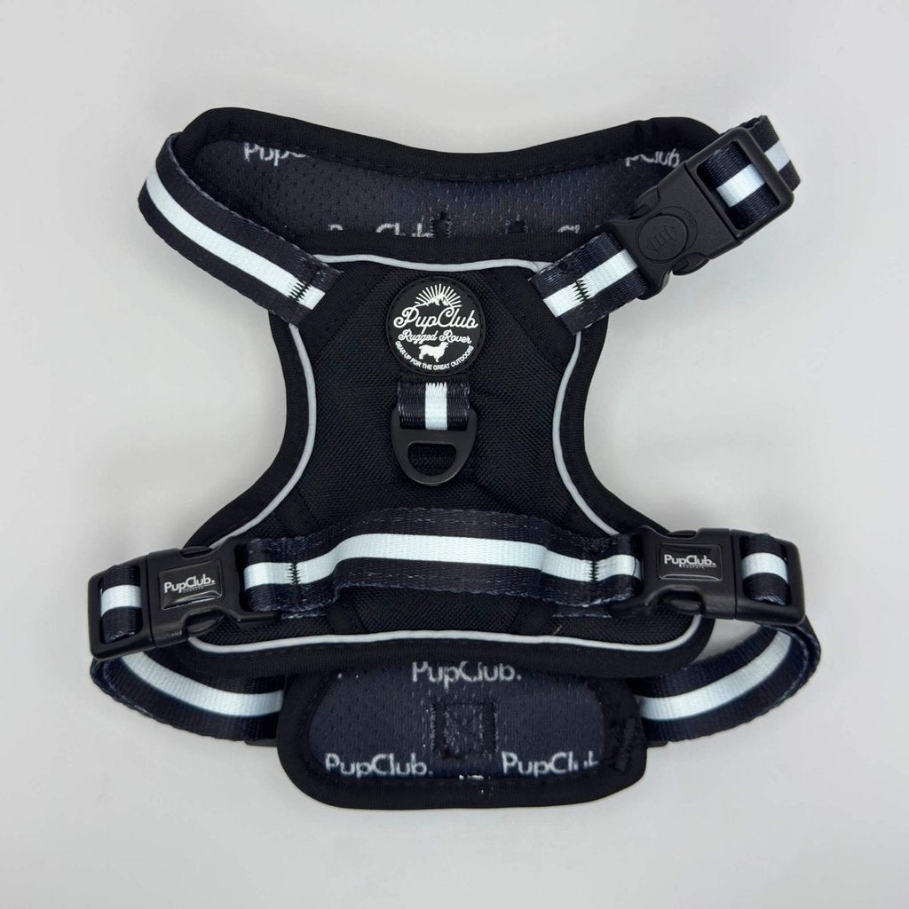Midnight black dog harness, back view with front chest buckle and white stripe trim