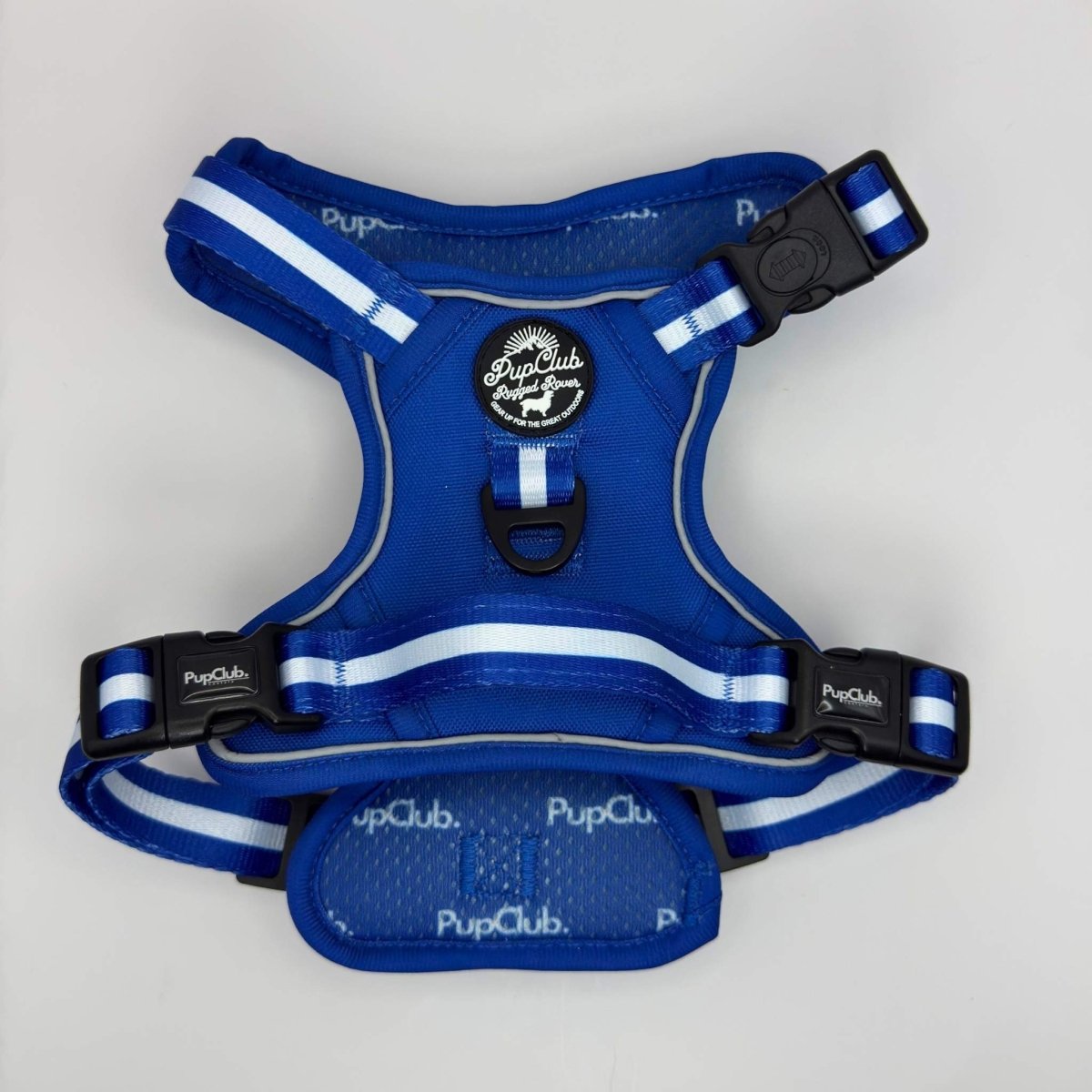 Blue step-in dog harness with white stripes, central chest patch, and black front strap.
